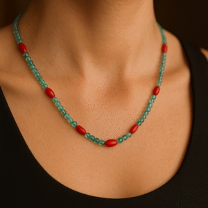 This delicate and vibrant necklace by Kozzah is crafted with natural apatite beads accented by vivid red coral-style beads. The design perfectly balances the cool oceanic hues of apatite with bold pops of red, creating a statement piece that exudes elegance and energy. This lightweight, 20-inch necklace is ideal for layering or wearing alone to add a touch of sophistication to any look.